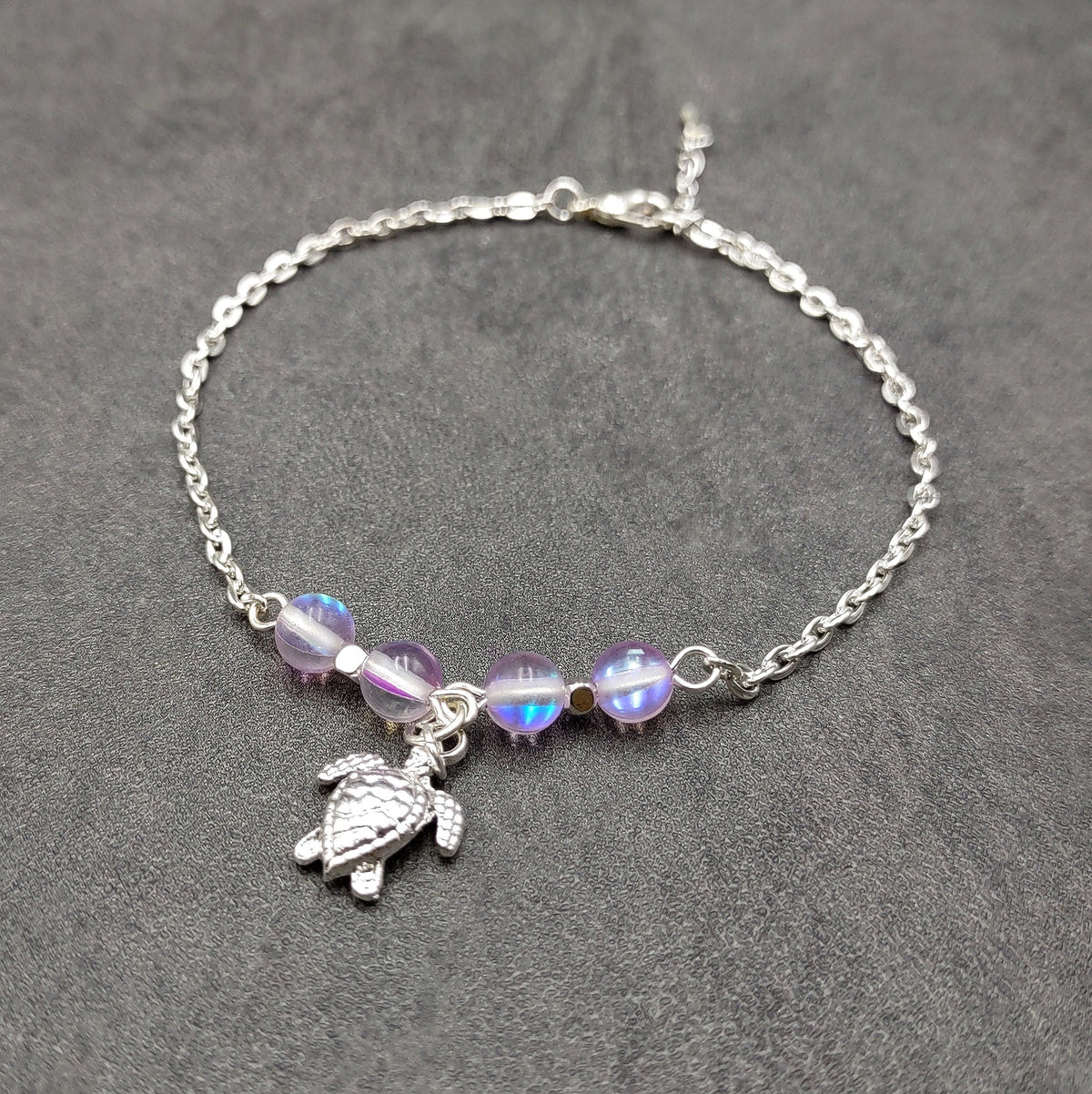 Sea Turtle Anklet Purple Beads Silver Color (approx. 9+ inches AROUND) Cute Light Purple Sea Turtle Charm Anklet for any beachy outfit!