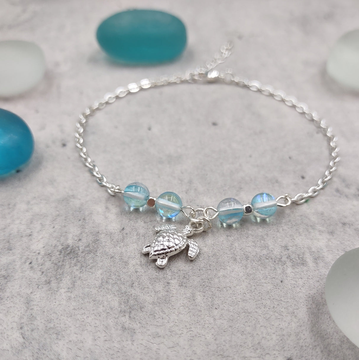 Sea Turtle Anklet Aqua Blue Beads Silver Color (approx. 9+ inches AROUND) Cute Blue Sea Turtle Charm Anklet for any beachy outfit!