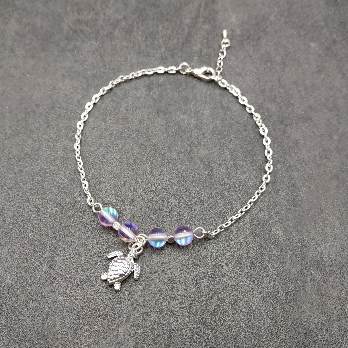 Sea Turtle Anklet Purple Beads Silver Color (approx. 9+ inches AROUND) Cute Light Purple Sea Turtle Charm Anklet for any beachy outfit!