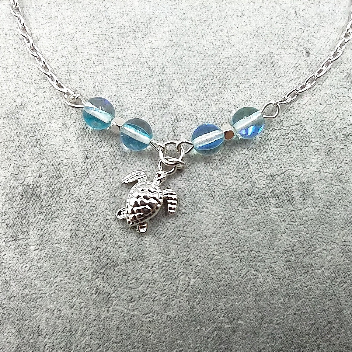 Sea Turtle Anklet Aqua Blue Beads Silver Color (approx. 9+ inches AROUND) Cute Blue Sea Turtle Charm Anklet for any beachy outfit!