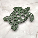 Cast Iron Sea Turtle Green Metal Trivet (1 trivet approx. 7+ inches wide) Green Metal Sea Turtle Trivet adds coastal charm & protection!