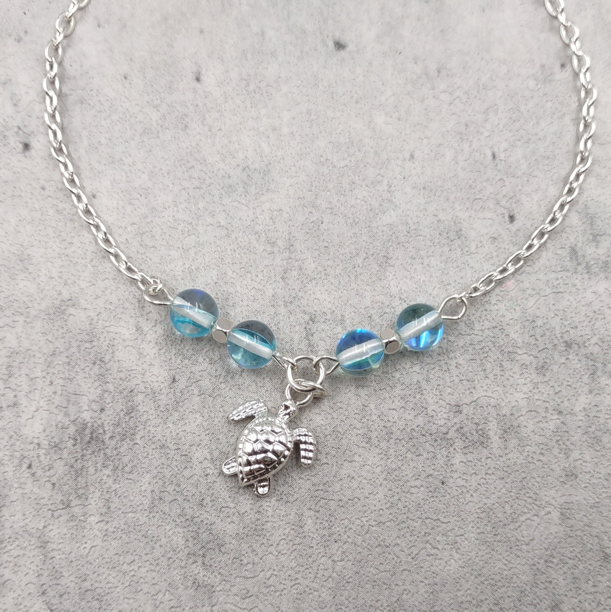 Sea Turtle Anklet Aqua Blue Beads Silver Color (approx. 9+ inches AROUND) Cute Blue Sea Turtle Charm Anklet for any beachy outfit!