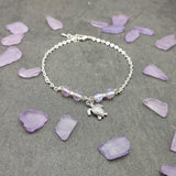 Sea Turtle Anklet Purple Beads Silver Color (approx. 9+ inches AROUND) Cute Light Purple Sea Turtle Charm Anklet for any beachy outfit!
